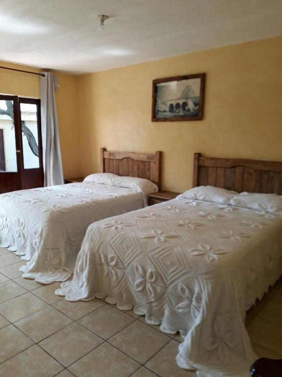 Postel nebo postele na pokoji v ubytování Hotel Villa Aurora