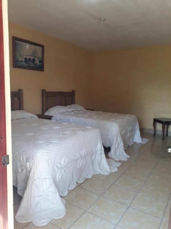 Postel nebo postele na pokoji v ubytování Hotel Villa Aurora