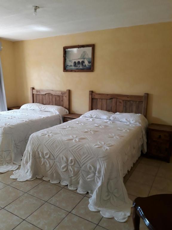Postel nebo postele na pokoji v ubytování Hotel Villa Aurora