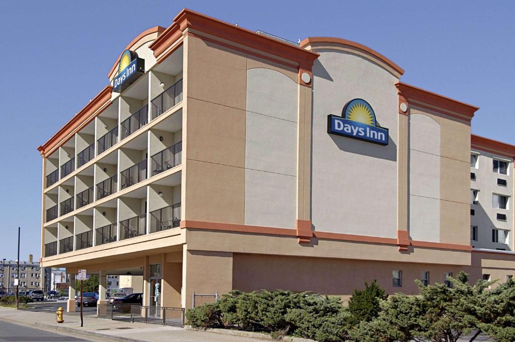 a rendering of a dasani hotel with a sign on it at Days Inn by Wyndham Atlantic City Beachblock in Atlantic City