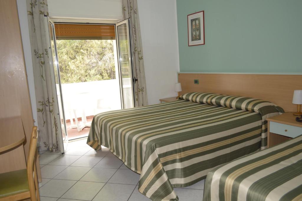 Postel nebo postele na pokoji v ubytování Hotel Zilema