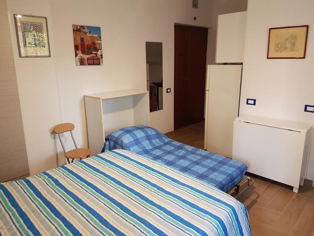 Posteľ alebo postele v izbe v ubytovaní Casa Vittoria