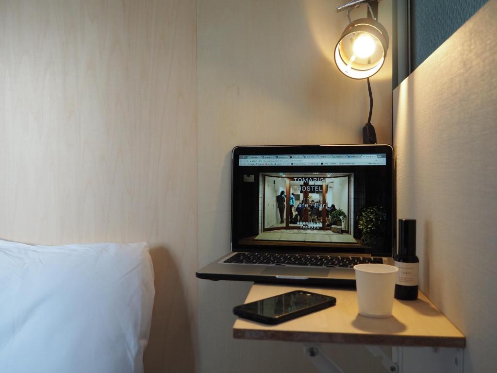 TV a/nebo společenská místnost v ubytování Tomarigi Hostel