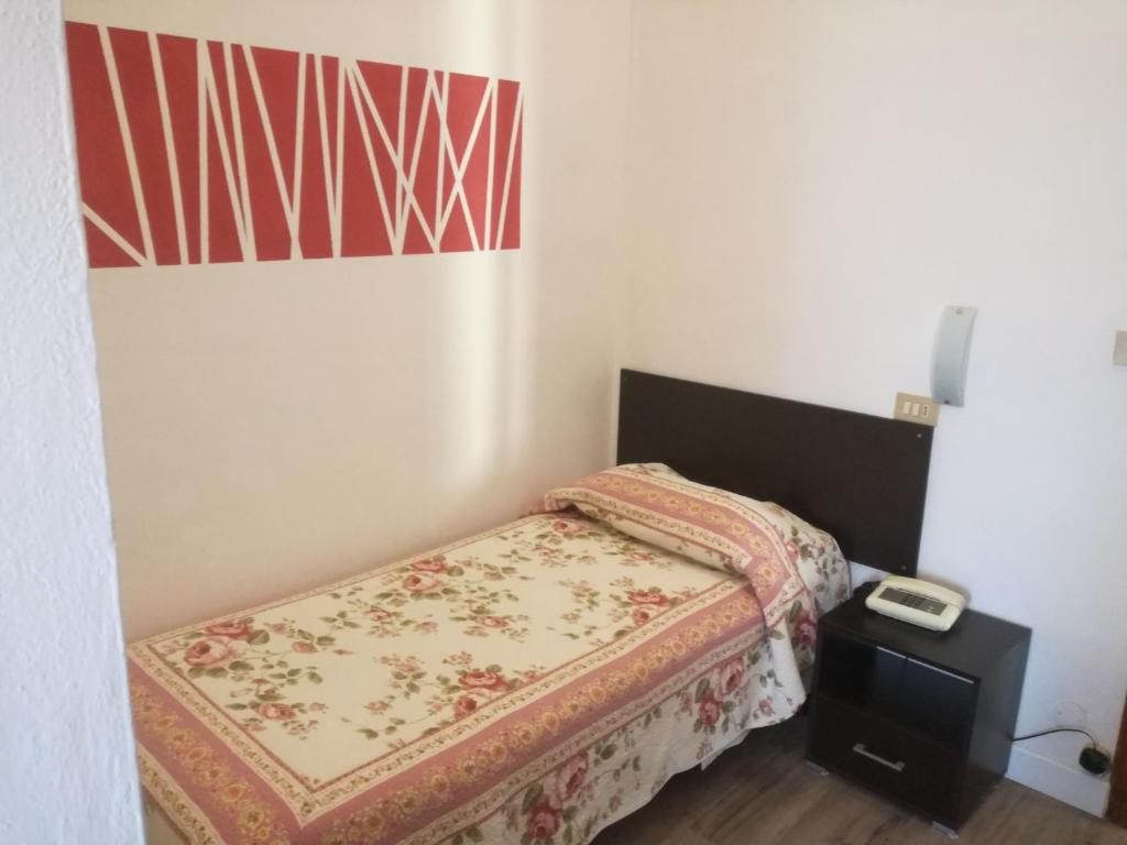 Postel nebo postele na pokoji v ubytování Hotel Prati