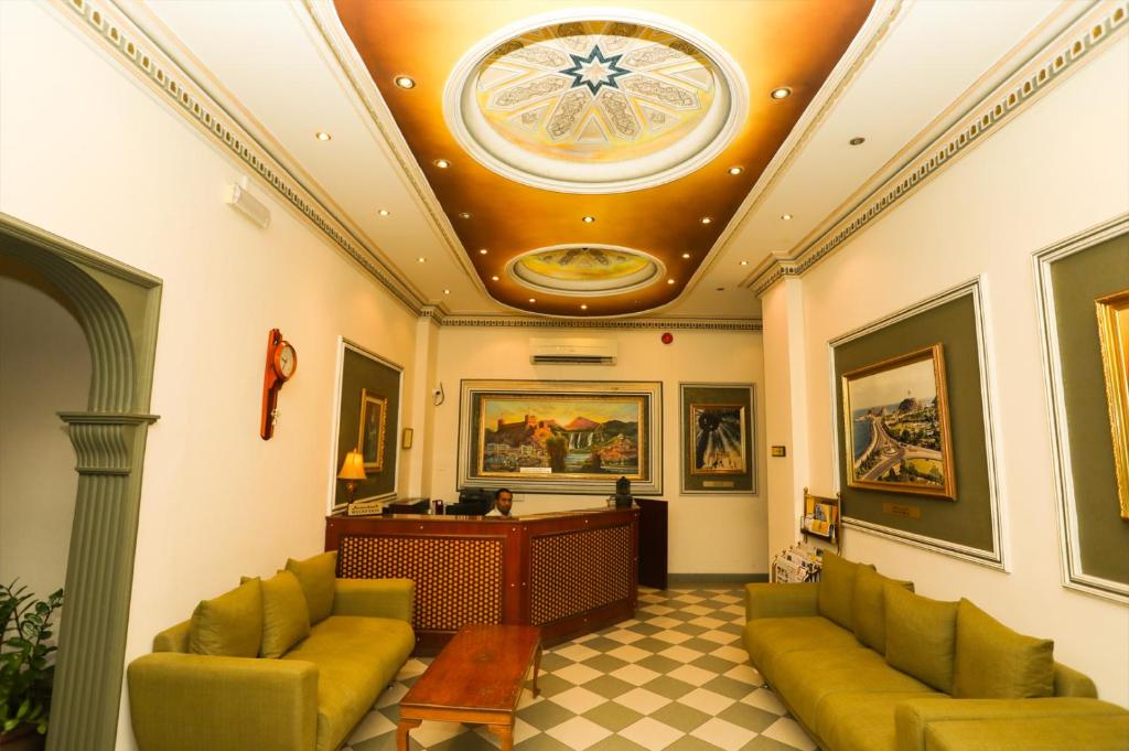 a lobby with a coffered ceiling and a desk at Al Shorouq Hotel Apartments in Muscat