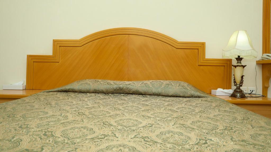 Postel nebo postele na pokoji v ubytování ltlalat Al Shorouq Hotel