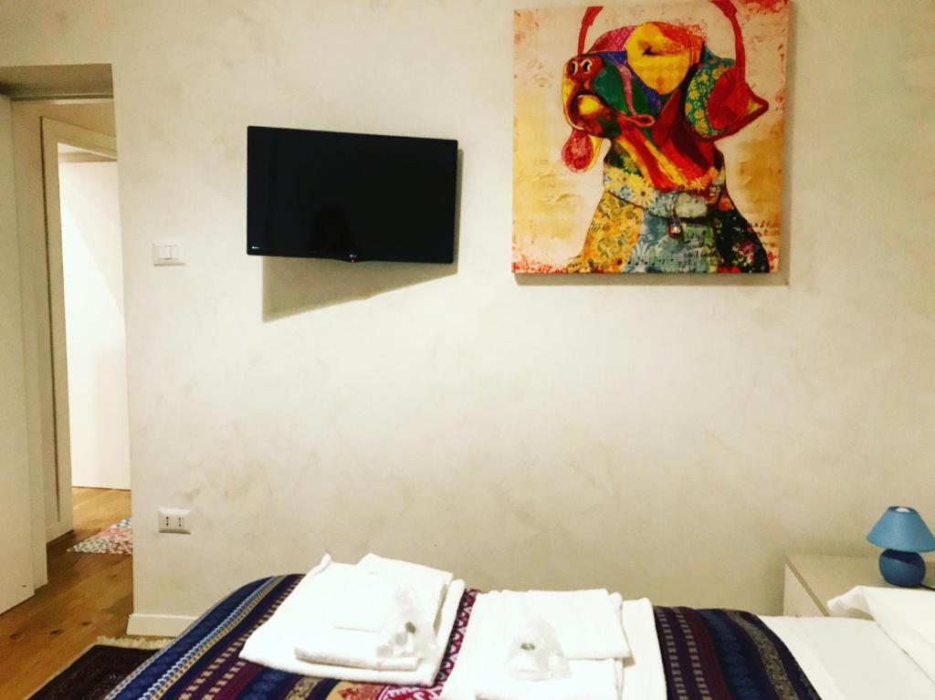 Televízia a/alebo spoločenská miestnosť v ubytovaní Casa "G&G Pignasecca"