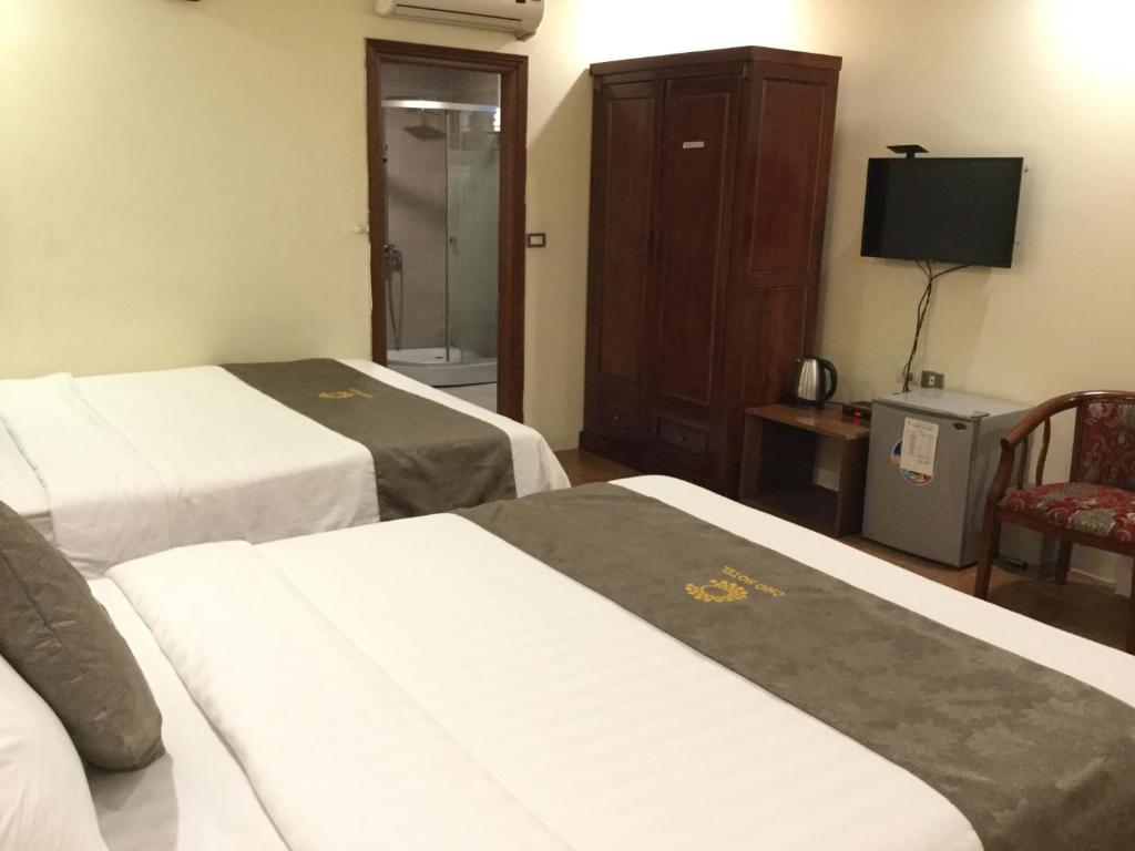 Postel nebo postele na pokoji v ubytování Chio Hotel