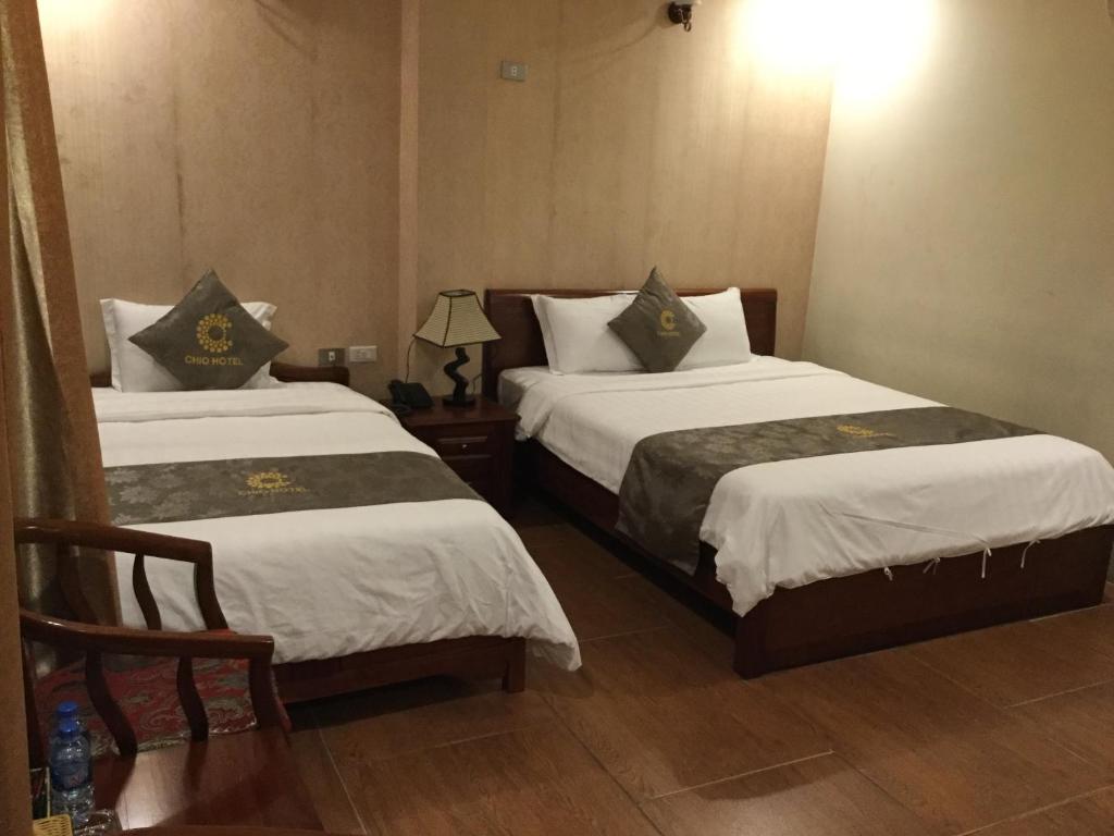 Postel nebo postele na pokoji v ubytování Chio Hotel