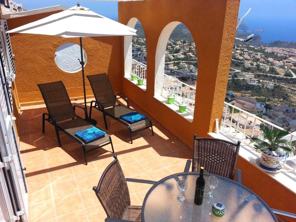 a balcony with a table and chairs and a view at Apartment Vistamar 2 in Cumbre del Sol