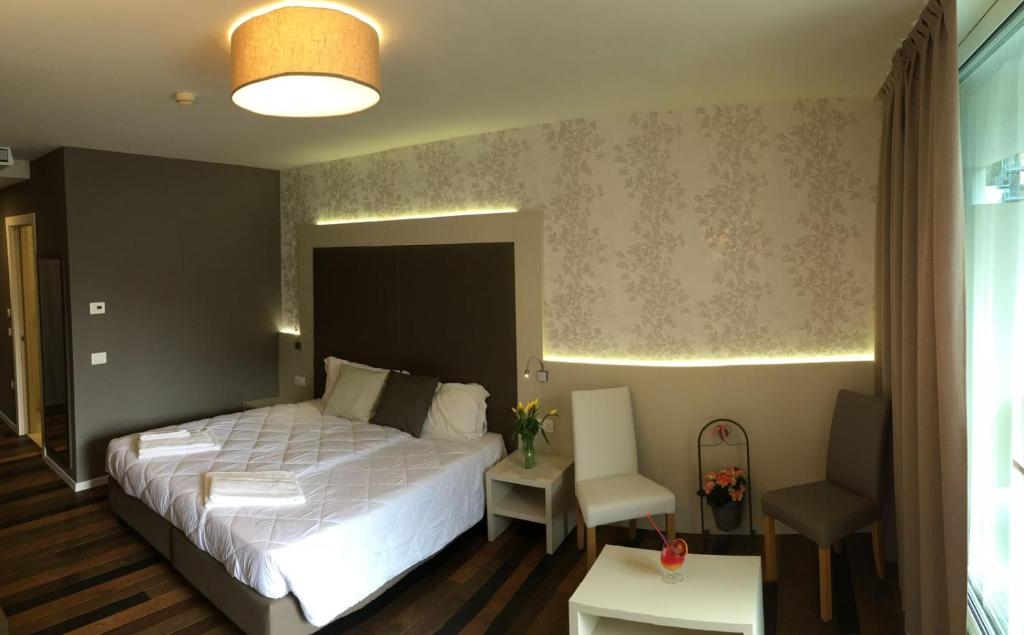 Posteľ alebo postele v izbe v ubytovaní Hotel Gardesana