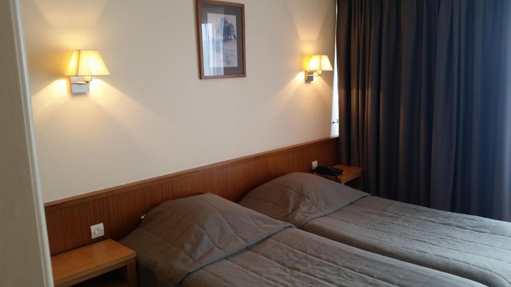 Postel nebo postele na pokoji v ubytování Hostellerie Reeb