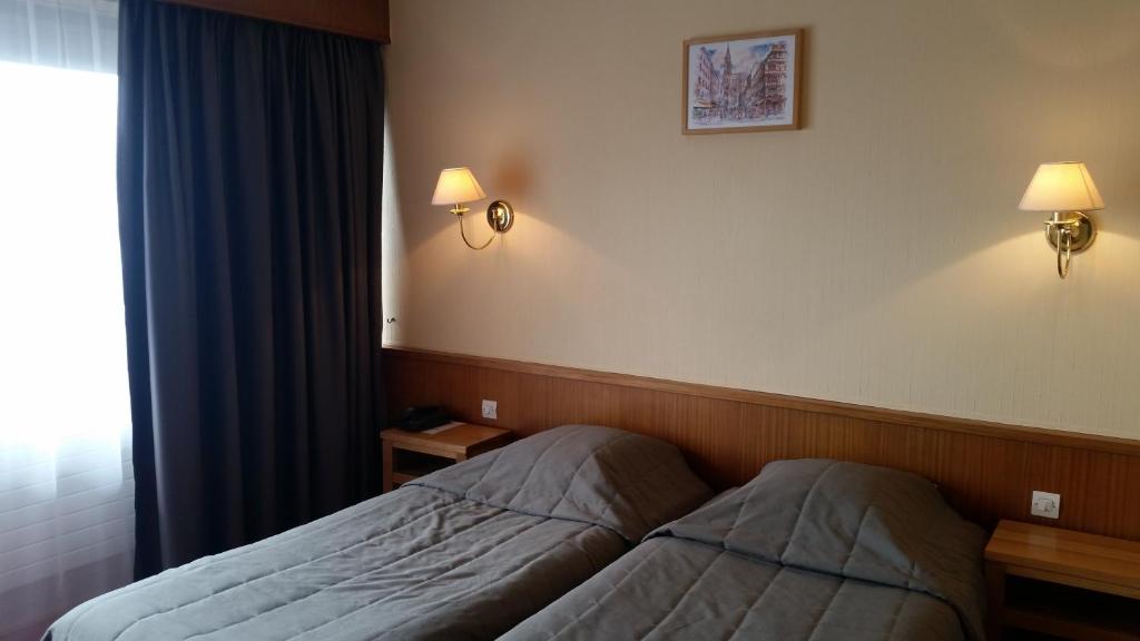 Postel nebo postele na pokoji v ubytování Hostellerie Reeb