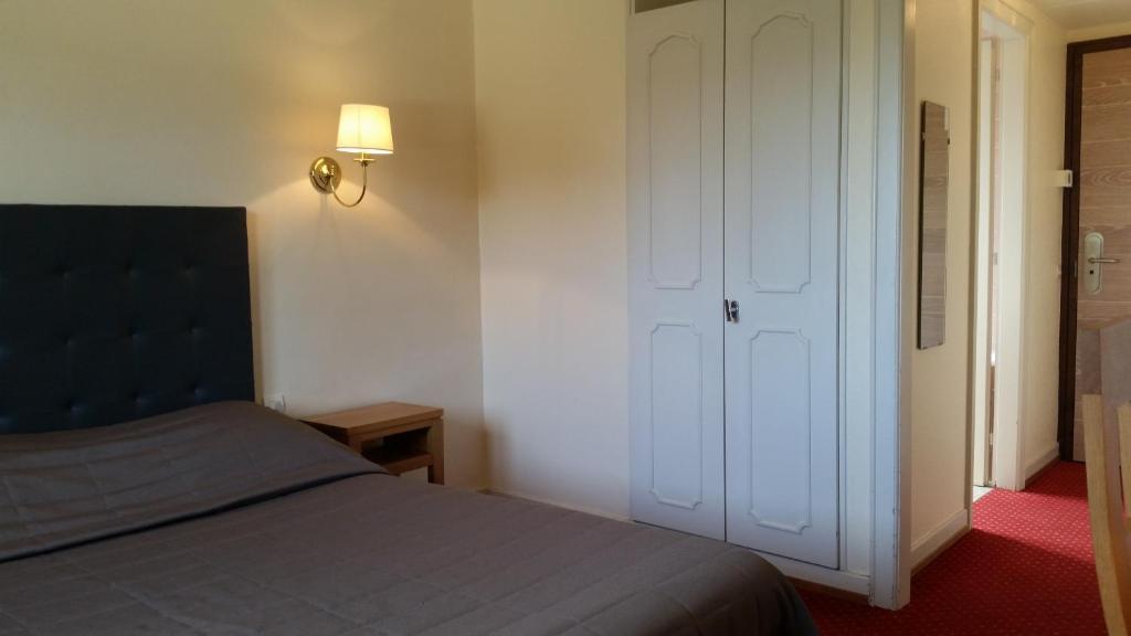 Postel nebo postele na pokoji v ubytování Hostellerie Reeb