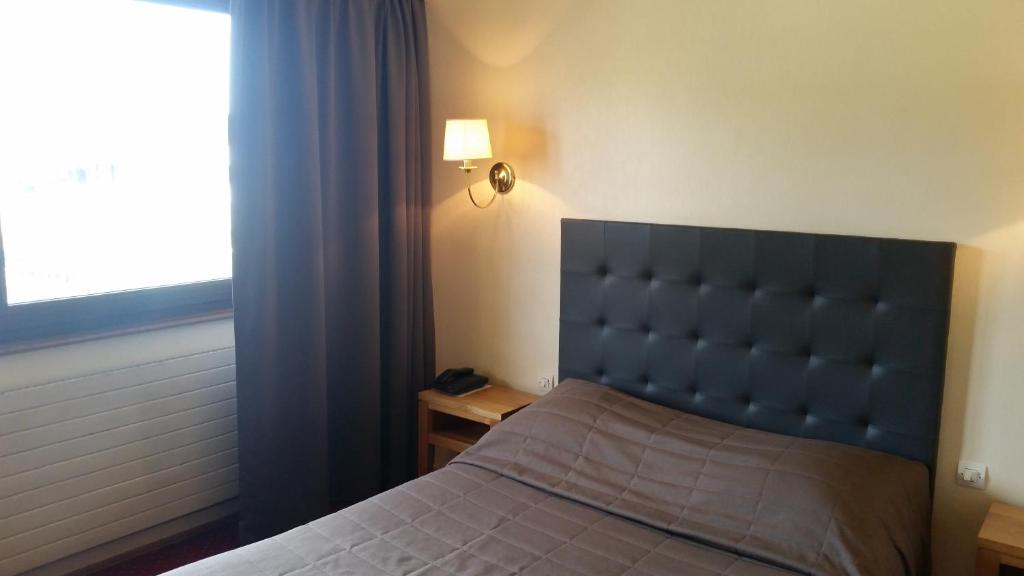 Postel nebo postele na pokoji v ubytování Hostellerie Reeb