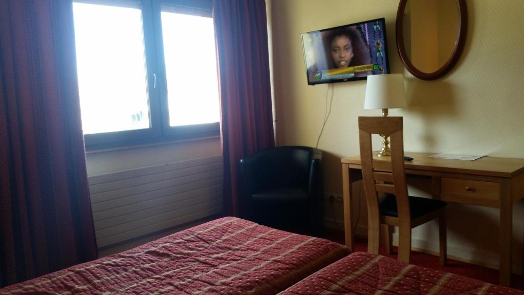 Postel nebo postele na pokoji v ubytování Hostellerie Reeb