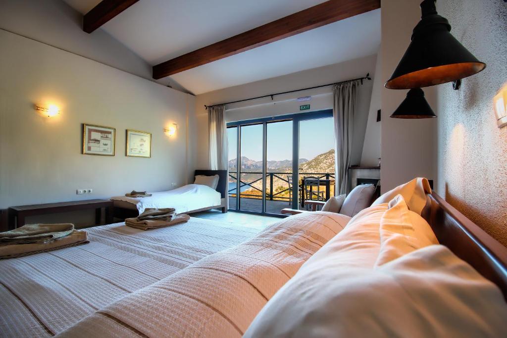Postel nebo postele na pokoji v ubytování Kekik Otel Selimiye