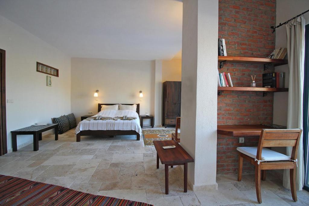 Postel nebo postele na pokoji v ubytování Kekik Otel Selimiye