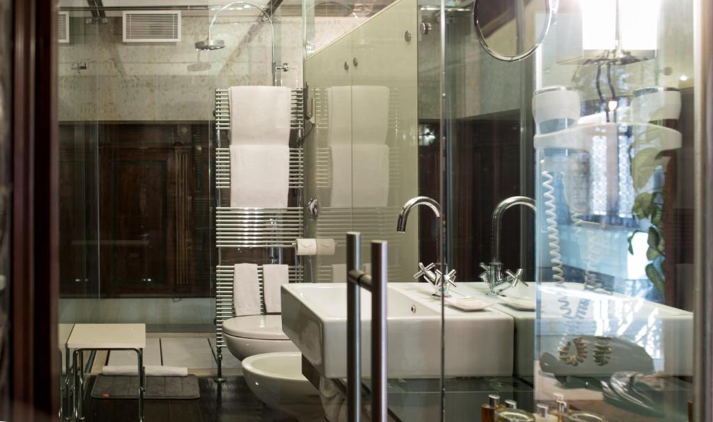 a bathroom with a sink and a toilet at Ca' Nigra Lagoon Resort Adults Only in Venice