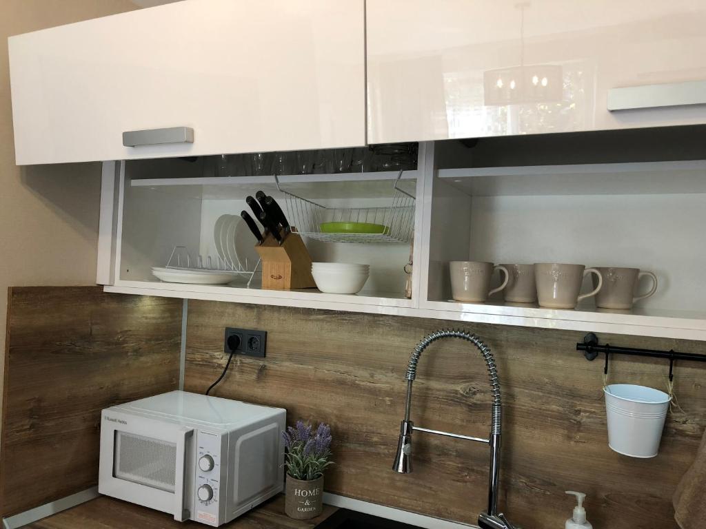 Kuchyň nebo kuchyňský kout v ubytování habitat Holiday Apartment