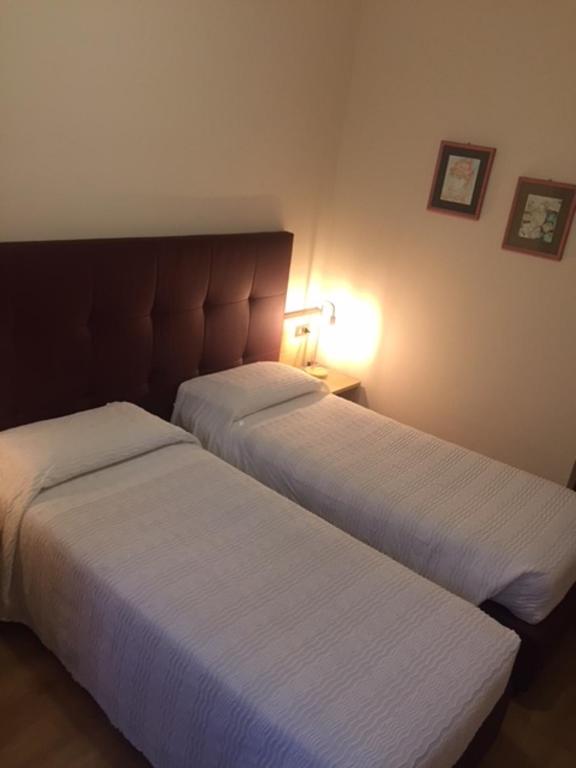 Een bed of bedden in een kamer bij Il Grifo