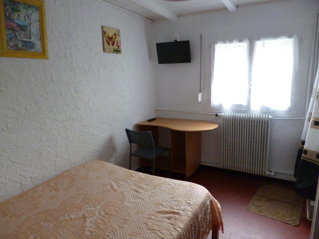 Postel nebo postele na pokoji v ubytování Hôtel le Calypso