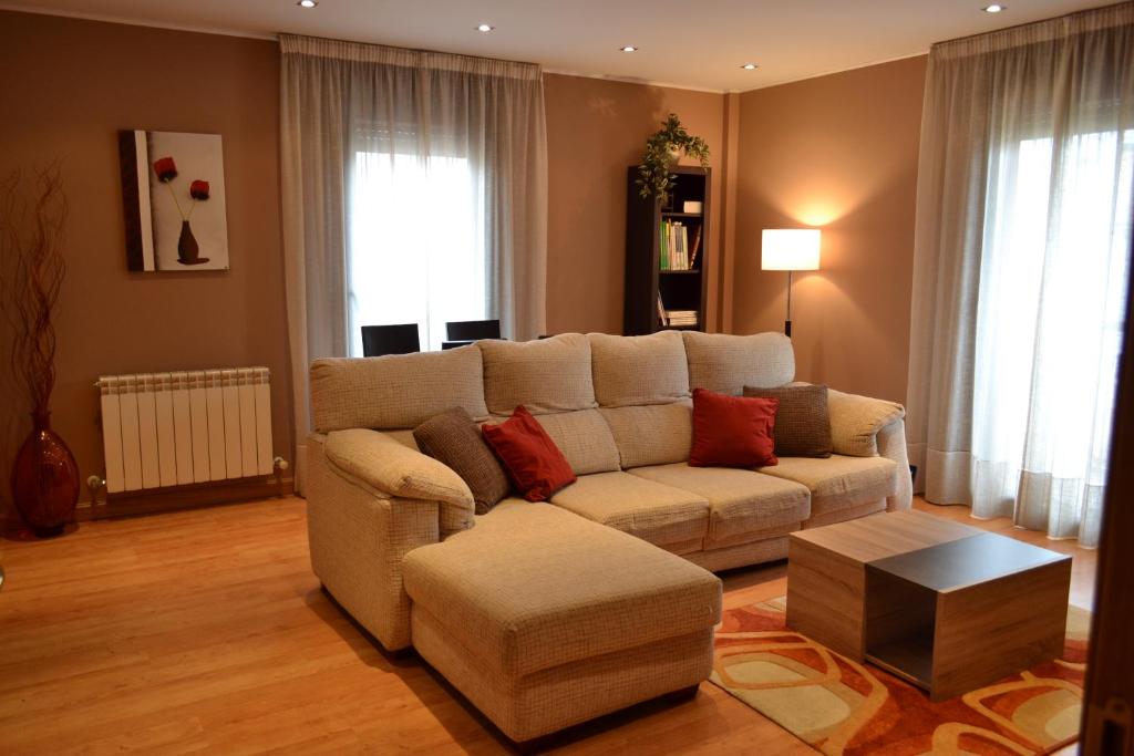 a living room with a couch and a table at Apartamento Nuevo Baztan in Elizondo