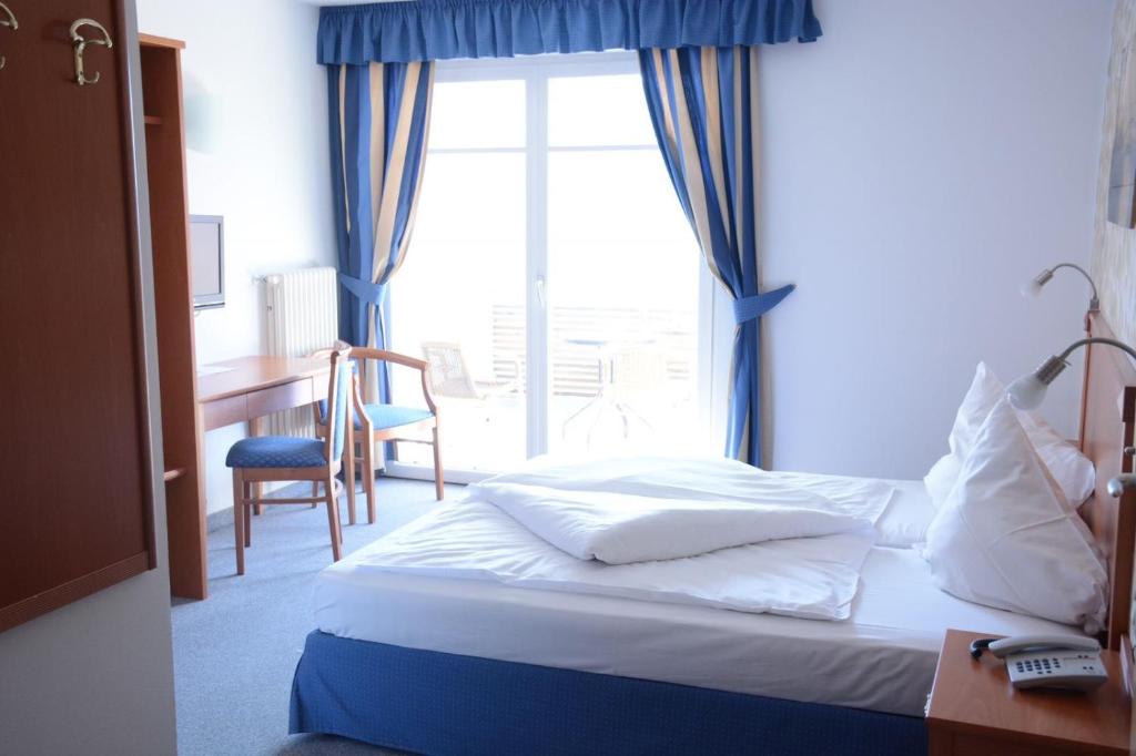 Postel nebo postele na pokoji v ubytování Hotel Tannerhof