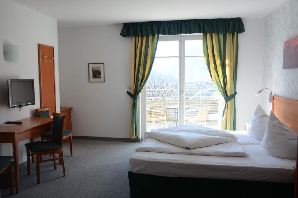 Postel nebo postele na pokoji v ubytování Hotel Tannerhof