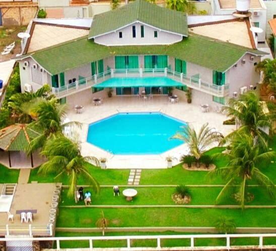an aerial view of a house with a swimming pool at Xingu Praia Hotel in Altamira