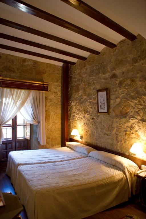 Postel nebo postele na pokoji v ubytování Hotel Microtel Placentinos