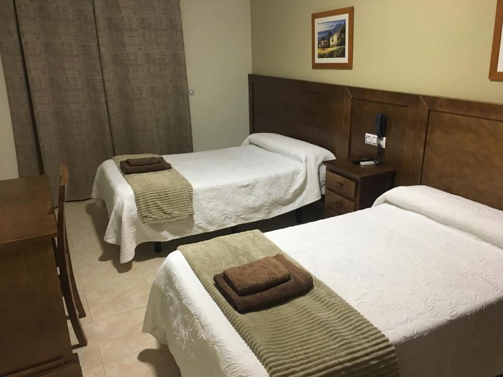 Postel nebo postele na pokoji v ubytování Hotel Don Juan