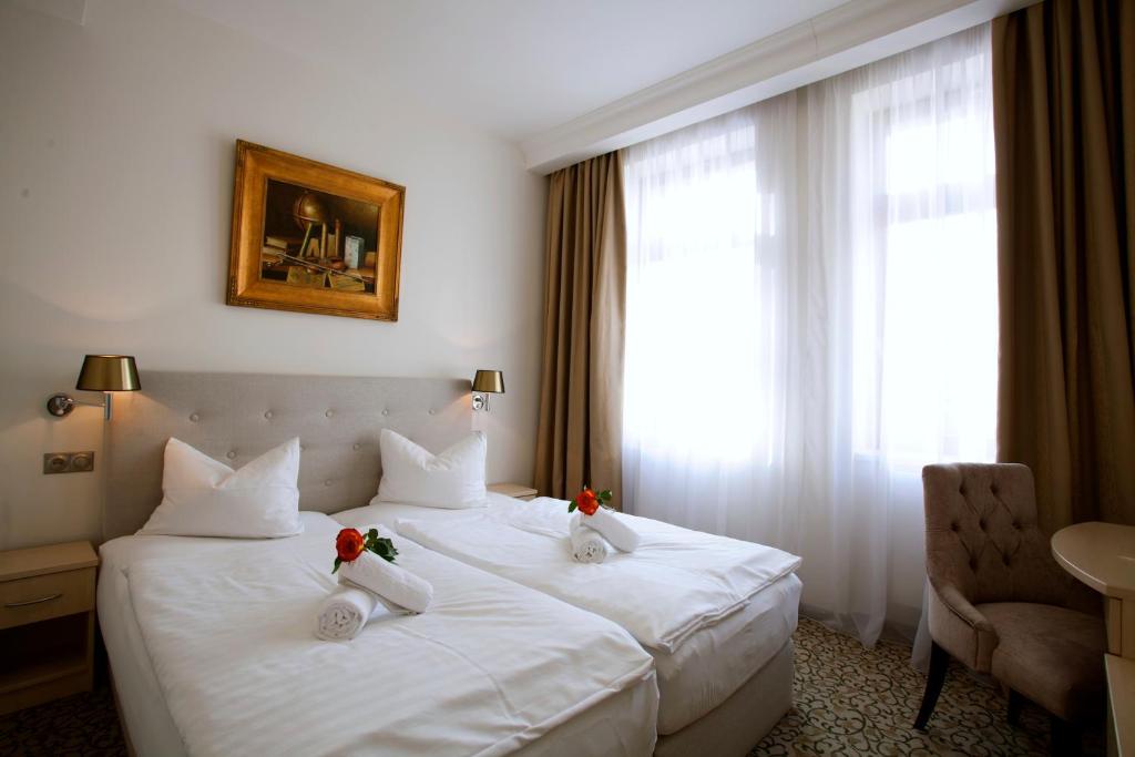 Postel nebo postele na pokoji v ubytování Hotel Ambiente Wellness & Spa
