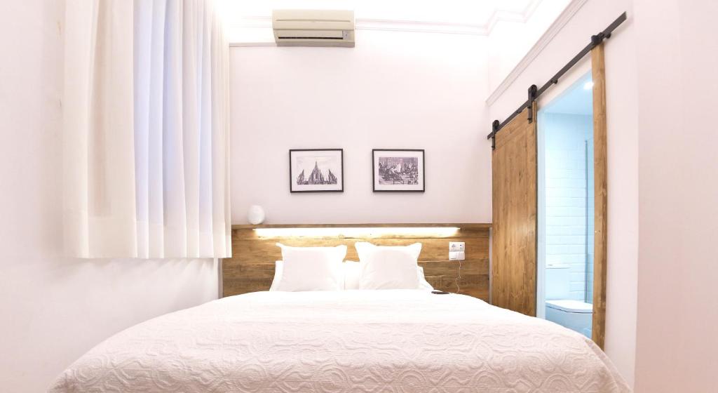 Posteľ alebo postele v izbe v ubytovaní Hostal Girona