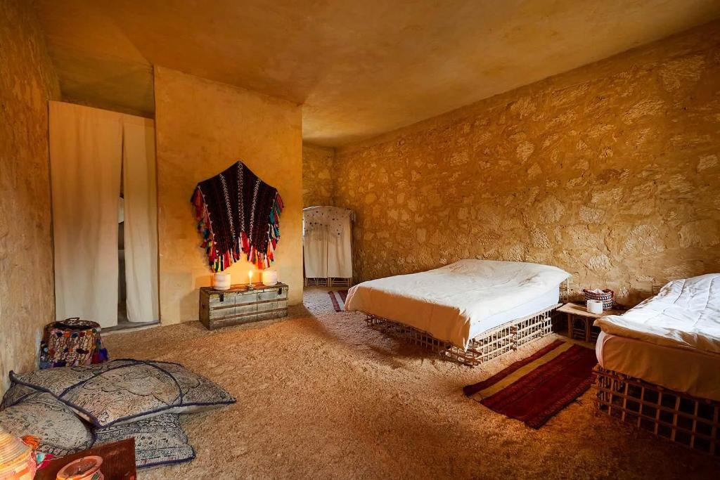En eller flere senge i et værelse på Siwa Relax Retreat Ecolodge
