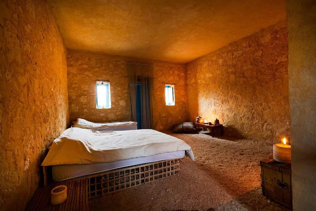 Postel nebo postele na pokoji v ubytování Siwa Relax Retreat Ecolodge