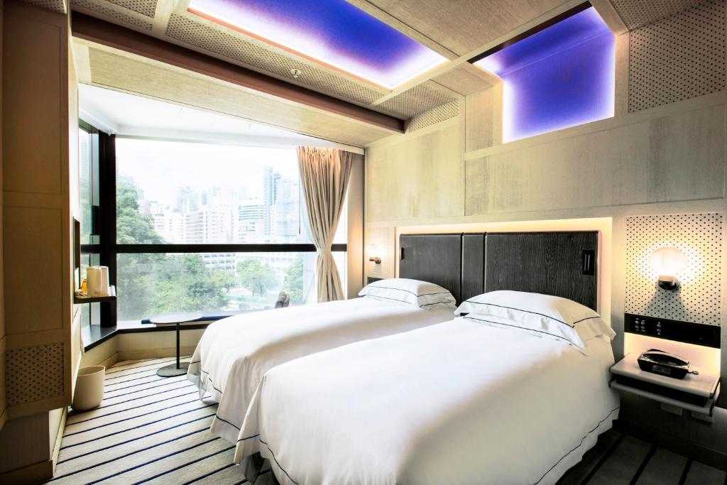 Letto o letti in una camera di The Emperor Hotel