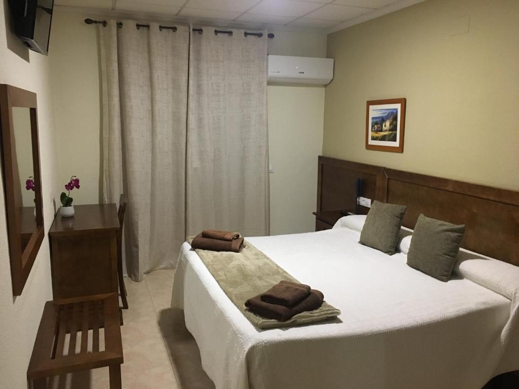 Postel nebo postele na pokoji v ubytování Hotel Don Juan
