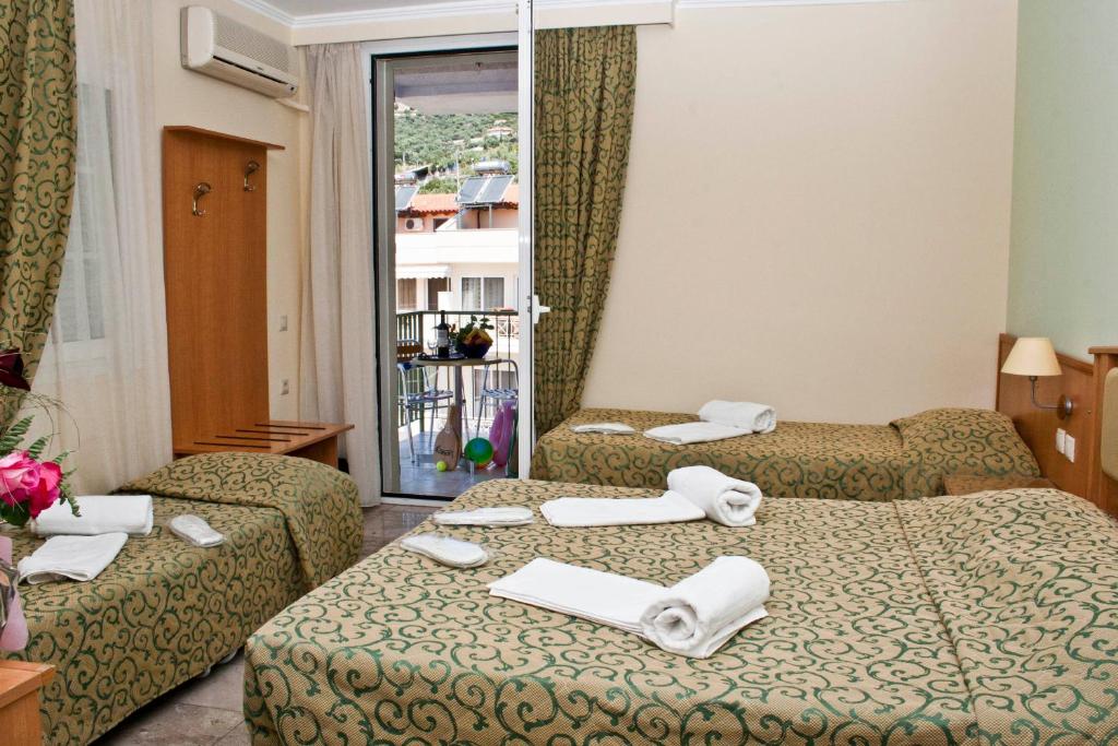 Postel nebo postele na pokoji v ubytování Tolon Holidays Hotel