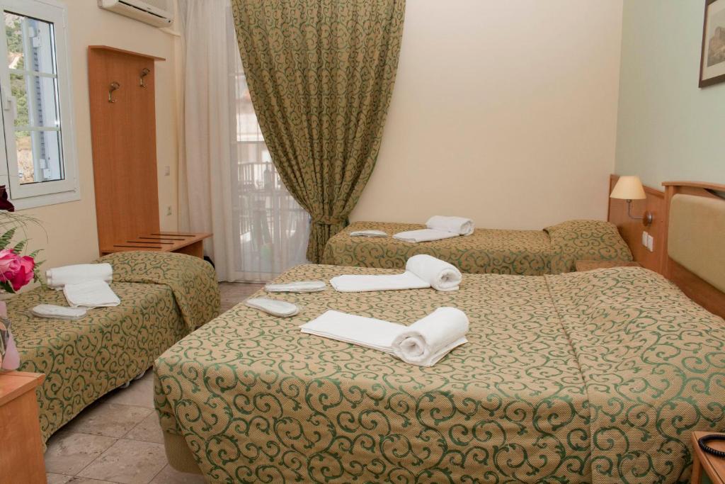 Postel nebo postele na pokoji v ubytování Tolon Holidays Hotel