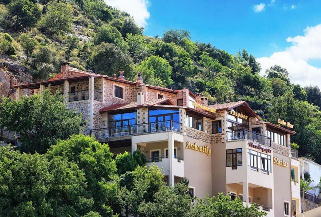 a house on the side of a mountain at Archontiko Manias in Axós