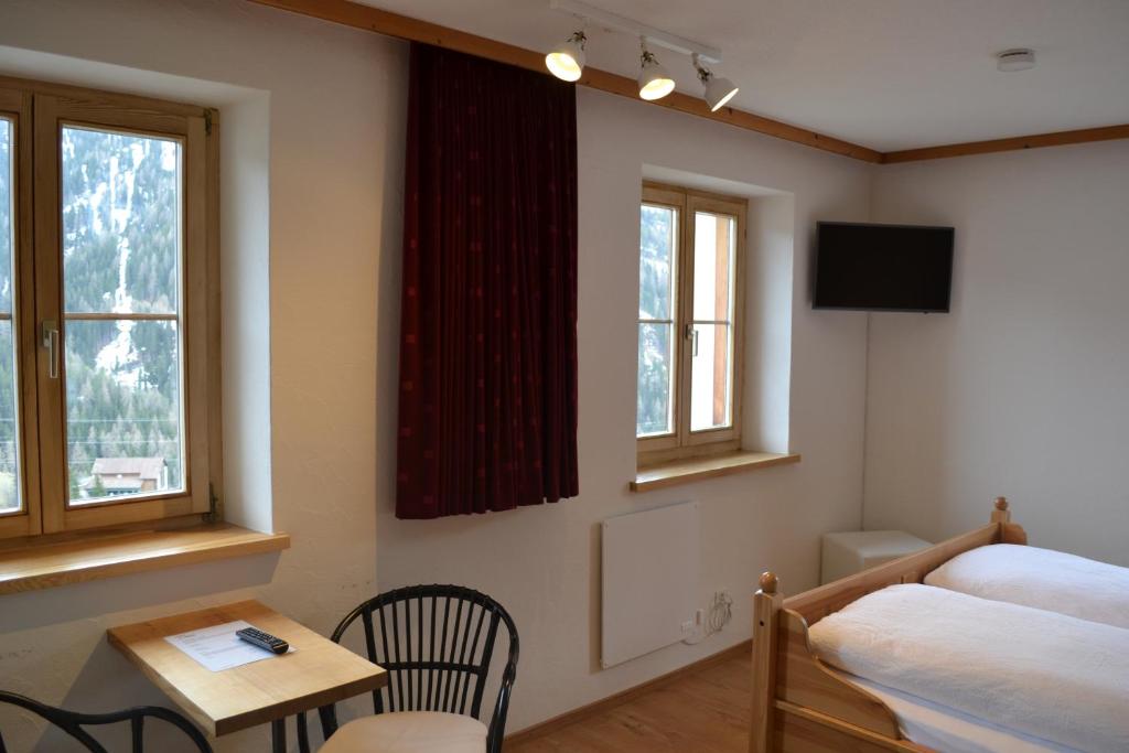 Postel nebo postele na pokoji v ubytování B&B Chasa Arfusch