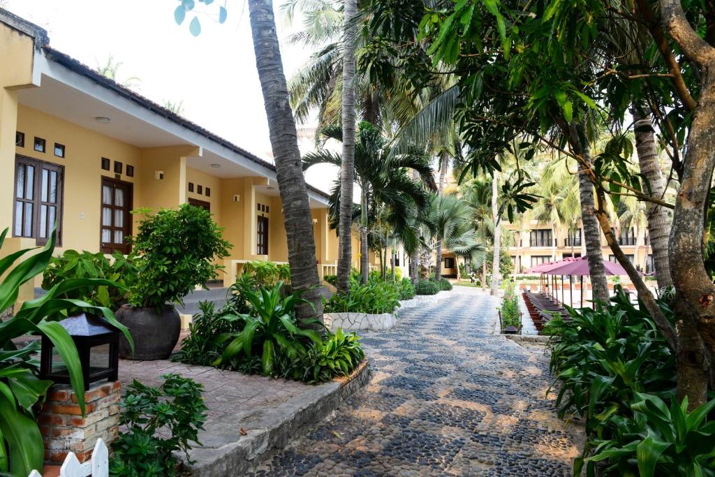 A garden outside Hon Rom Central Beach Resort