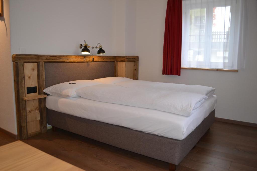 Postel nebo postele na pokoji v ubytování B&B Chasa Arfusch