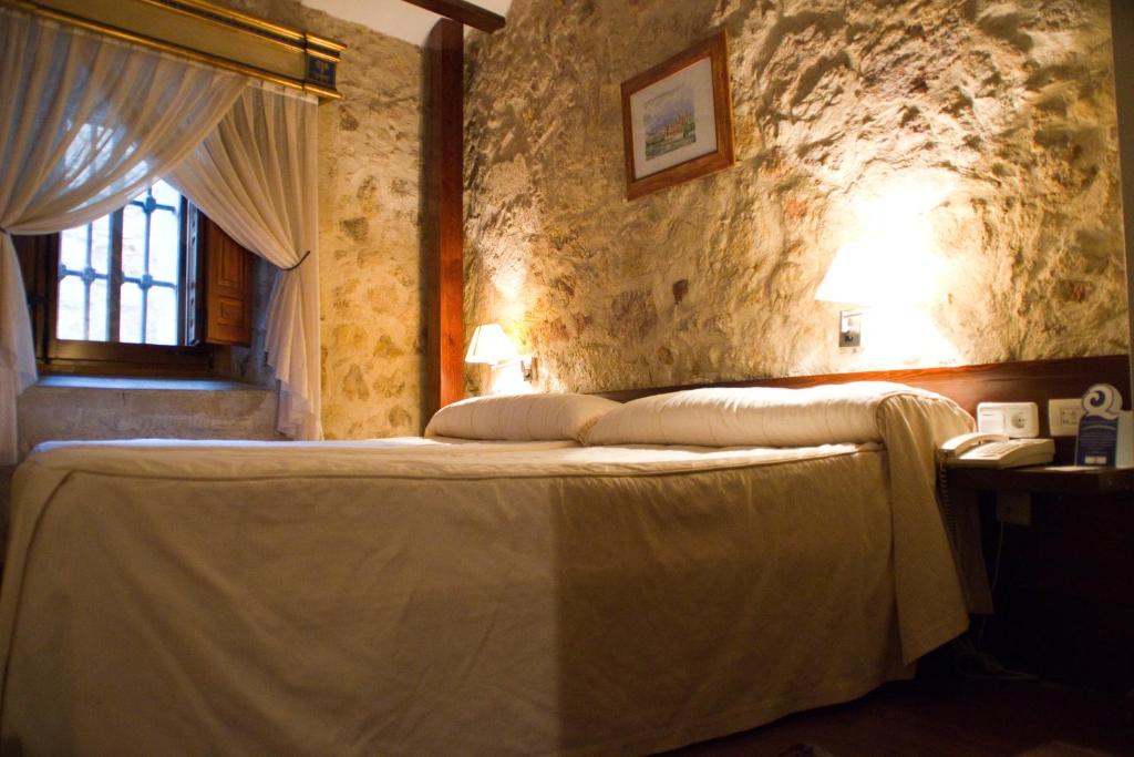 Postel nebo postele na pokoji v ubytování Hotel Microtel Placentinos