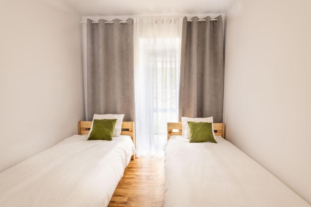 Posteľ alebo postele v izbe v ubytovaní Halna Residence