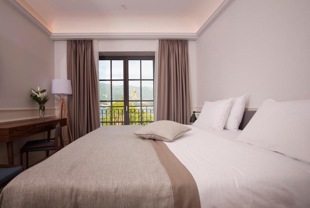 Posteľ alebo postele v izbe v ubytovaní Hotel Majestic