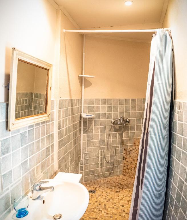 a bathroom with a sink and a shower at A jewel by the river! in Fontaine-de-Vaucluse