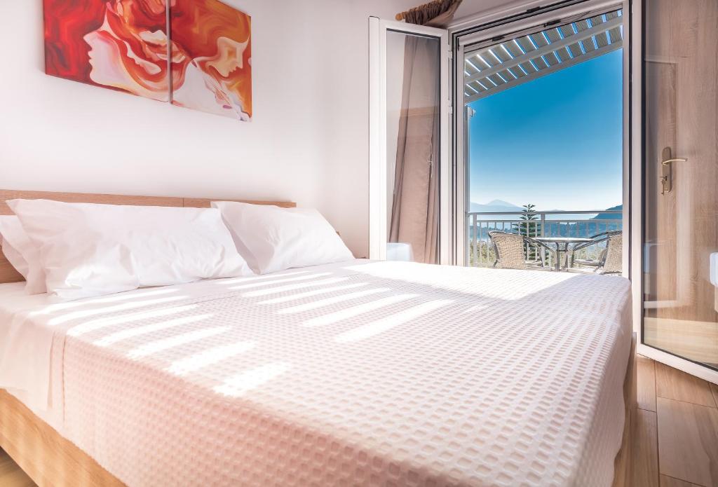Posteľ alebo postele v izbe v ubytovaní Abeli Villas