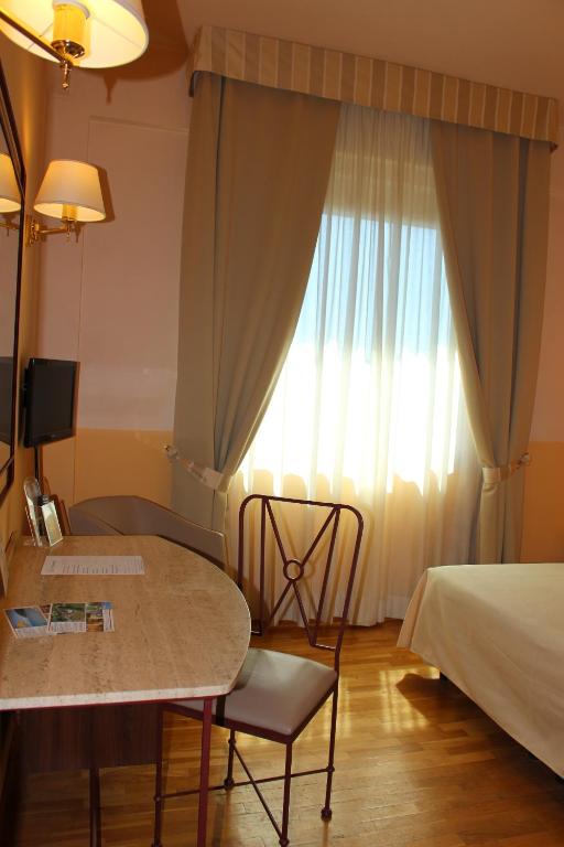 Postel nebo postele na pokoji v ubytování Hotel Semifonte